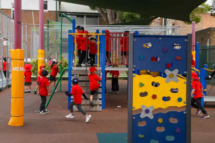 Children playing on climbing equipment.