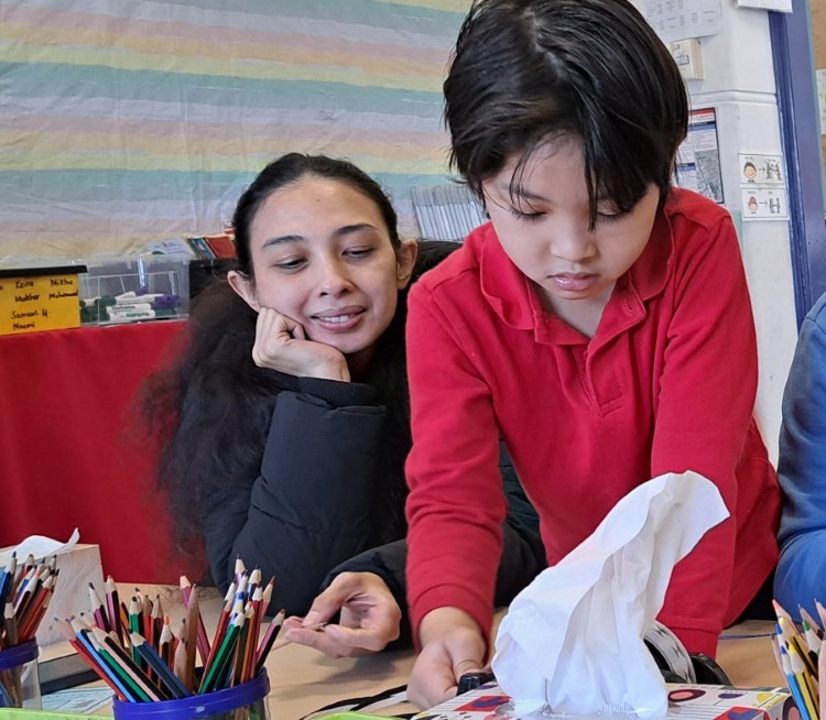 Parent watching student in classroom